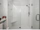 Large walk-in shower with glass enclosure and built-in seat at 1632 Telfair Way, Charleston, SC 29412