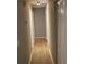 Long hallway with light gray walls and wood-look floors at 186 Bridgecreek Dr, Goose Creek, SC 29445