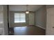 Bright living room with neutral walls, wood-look floors, and a window at 186 Bridgecreek Dr, Goose Creek, SC 29445