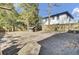 Spacious fenced-in backyard with mature trees and a dog house at 1904 Iris St, North Charleston, SC 29405