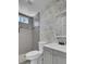 Stylish bathroom featuring modern wallpaper, vanity, tile shower and updated fixtures at 1904 Iris St, North Charleston, SC 29405
