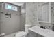 Beautiful bathroom featuring modern wallpaper, vanity and tile shower at 1904 Iris St, North Charleston, SC 29405