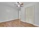 Bedroom with hardwood floors, closet, light walls and ceiling fan at 1904 Iris St, North Charleston, SC 29405