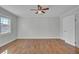 Inviting bedroom featuring wood floors, a ceiling fan, and a window for ample natural light at 1904 Iris St, North Charleston, SC 29405