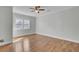 Bright bedroom featuring a ceiling fan, a window that allows in plenty of natural light, and wood flooring at 1904 Iris St, North Charleston, SC 29405