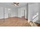 Bright bedroom with multiple closets, wood flooring, ceiling fan and fresh paint at 1904 Iris St, North Charleston, SC 29405