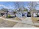 Quaint blue home featuring a welcoming front yard with a classic design at 1904 Iris St, North Charleston, SC 29405
