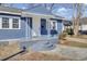 Welcoming porch with gray stairs and white door at 1904 Iris St, North Charleston, SC 29405