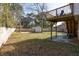 Large backyard with a deck, shed, and fenced area at 210 Drexel Rd, Ladson, SC 29456