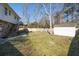 Large backyard with a deck, shed, and fenced area at 210 Drexel Rd, Ladson, SC 29456