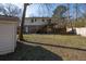 Large backyard with a deck, shed, and fenced area at 210 Drexel Rd, Ladson, SC 29456