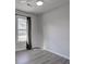 Simple bedroom with gray floors and a window at 210 Drexel Rd, Ladson, SC 29456