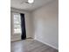 Simple bedroom with gray walls and wood floors at 210 Drexel Rd, Ladson, SC 29456