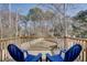 Deck with two blue chairs overlooking backyard at 210 Drexel Rd, Ladson, SC 29456