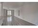 Open living area with hardwood floors and a large window providing natural light at 210 Drexel Rd, Ladson, SC 29456