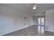 Bright living room featuring hardwood floors and sliding glass doors leading to a deck at 210 Drexel Rd, Ladson, SC 29456