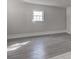 Simple living room with gray vinyl flooring at 210 Drexel Rd, Ladson, SC 29456