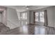 Spacious living area with hardwood floors, neutral walls, and a view of the staircase at 210 Drexel Rd, Ladson, SC 29456