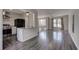 Spacious living area with hardwood floors and open concept to kitchen at 210 Drexel Rd, Ladson, SC 29456