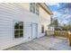 Exterior home view of the deck with white siding, wooden railings, and brick foundation at 213 Rose Ave, Walterboro, SC 29488