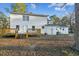 Exterior home view with a deck and spacious backyard, with white siding and brick foundation at 213 Rose Ave, Walterboro, SC 29488