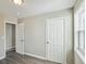 Bedroom with modern gray walls, gray vinyl floors, and white trim at 213 Rose Ave, Walterboro, SC 29488