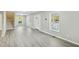 Spacious living room showcases stairs to the second floor and natural light at 213 Rose Ave, Walterboro, SC 29488