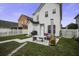 Charming backyard with patio, outdoor seating, grill, and a vintage chimney at 221 Trillium Ave, Summerville, SC 29483