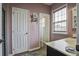 Elegant bathroom with a window for natural light and a door leading to another room at 221 Trillium Ave, Summerville, SC 29483
