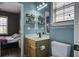 Stylish bathroom featuring a vanity, toilet and a decorative mirror with an open doorway to the bedroom at 221 Trillium Ave, Summerville, SC 29483