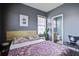 Charming bedroom featuring stylish decor, cool gray walls and an ensuite bathroom at 221 Trillium Ave, Summerville, SC 29483