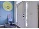 Bright entryway featuring stylish decor, including a colorful wall accent and sleek white door at 221 Trillium Ave, Summerville, SC 29483