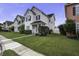 Charming home surrounded by other colorful houses, with a tidy lawn, sidewalk, and welcoming feel at 221 Trillium Ave, Summerville, SC 29483