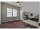 Cozy office space with a ceiling fan and a large window for natural light at 221 Trillium Ave, Summerville, SC 29483