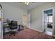 Spacious office space featuring a work area, office chair, and a gray accent wall at 221 Trillium Ave, Summerville, SC 29483