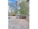 A large backyard with a white gazebo and surrounded by lush trees and plants at 227 Bailey St, Walterboro, SC 29488
