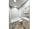Clean bathroom features shower and tub combo, neutral walls, and modern vanity at 227 Bailey St, Walterboro, SC 29488