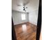 Bright bedroom featuring beautiful hardwood floors, ceiling fan, and a window for natural light at 227 Bailey St, Walterboro, SC 29488