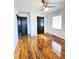 Bedroom with hardwood flooring and ceiling fan and light fixture, natural light from windows at 227 Bailey St, Walterboro, SC 29488