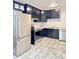 Contemporary kitchen featuring stainless steel appliances and stylish black cabinets with modern countertops at 227 Bailey St, Walterboro, SC 29488