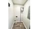 Utility room featuring modern water heater, and hardwood floors at 227 Bailey St, Walterboro, SC 29488