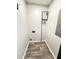 Utility room featuring modern water heater, and hardwood floors at 227 Bailey St, Walterboro, SC 29488