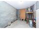 Unfinished basement with concrete walls, containing utility equipment like a hot water heater and space for storage at 2517 Charter Oaks Dr, Mount Pleasant, SC 29466
