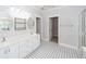 Double vanity bathroom with frameless shower and patterned tile floor at 2517 Charter Oaks Dr, Mount Pleasant, SC 29466