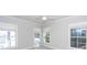 Spacious bedroom with three windows, neutral walls, and carpeting at 2517 Charter Oaks Dr, Mount Pleasant, SC 29466