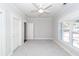 Well-lit bedroom featuring a ceiling fan and large windows at 2517 Charter Oaks Dr, Mount Pleasant, SC 29466