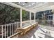 Relaxing deck with pergola and wooden bench, overlooking wooded backyard at 2517 Charter Oaks Dr, Mount Pleasant, SC 29466