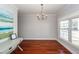 Spacious dining room with hardwood floors, large windows, and chandelier at 2517 Charter Oaks Dr, Mount Pleasant, SC 29466