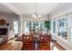 Sunlit dining room with hardwood floors and a rustic wooden table at 2517 Charter Oaks Dr, Mount Pleasant, SC 29466