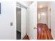 Modern home elevator with white accordion doors and hardwood floors at 2517 Charter Oaks Dr, Mount Pleasant, SC 29466
